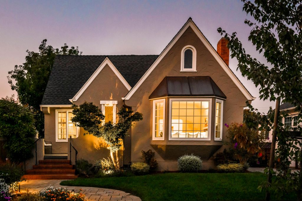 Twilight photo of home on Carlos Avenue.