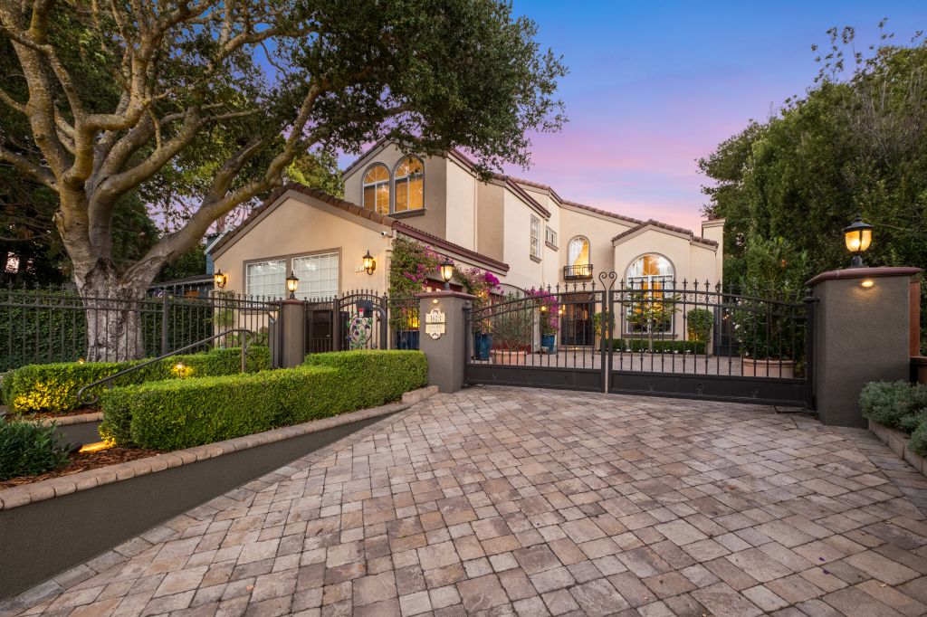 Exterior twilight with front gate at 1613 Sanchez Ave in the Burlingame Park neighborhood in Burlingame.