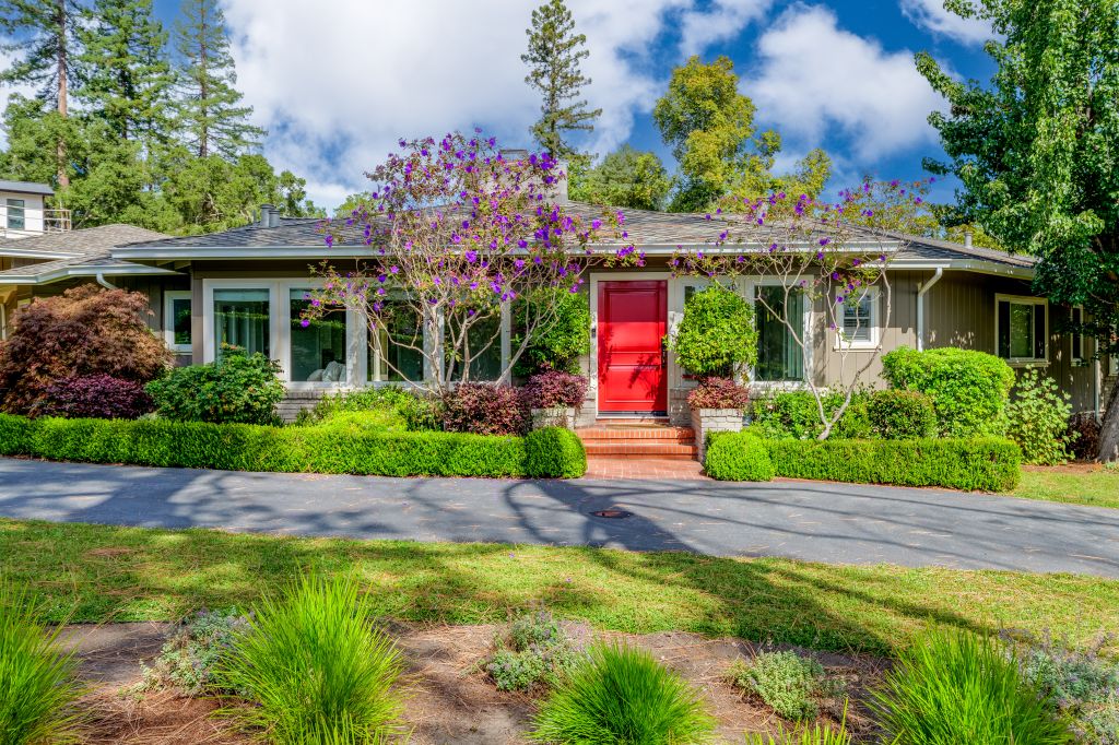 Front exterior with red door at 3990 Ralston Avenue in the Carolands neighborhood in Hillsborough.