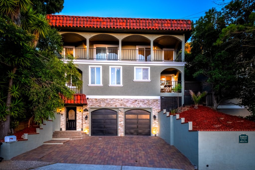 Front exterior twilight at 1931 Hillman Ave in the Belmont Country Club neighborhood in Belmont.