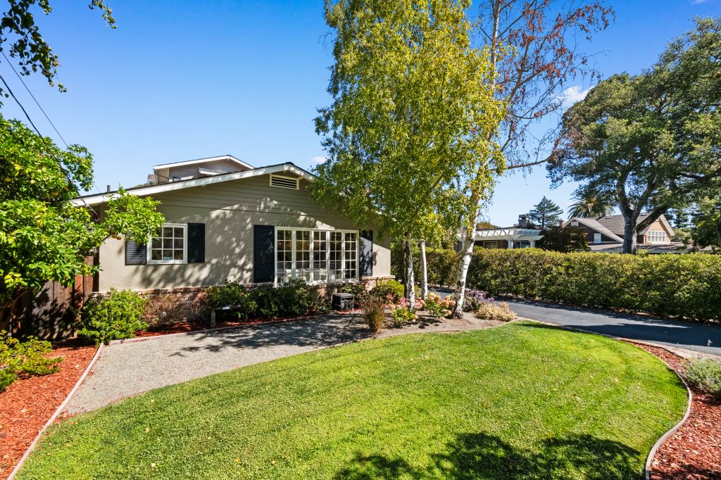 Front exterior with tree and grass at 816 Newhall Road in the Burlingame Park in Burlingame.