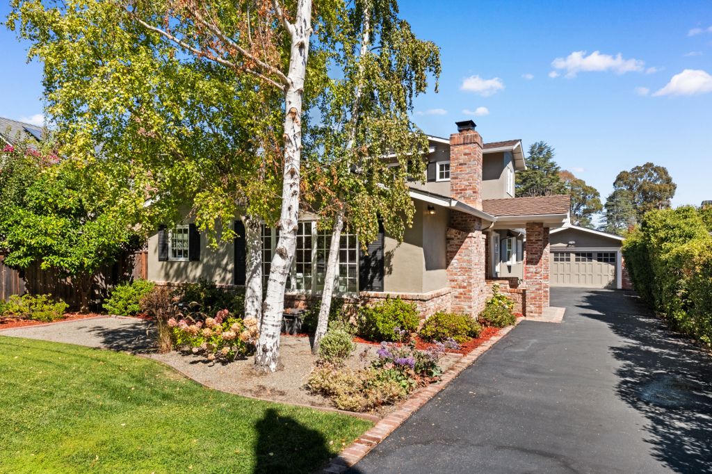 Front exterior with view of driveway at 816 Newhall Road in the Burlingame Park neighborhood in Burlingame.